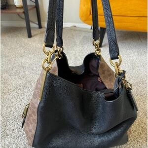 Coach large medium shoulder bag with three sections.